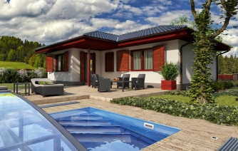 Casa en forma de L con tejado a cuatro aguas.